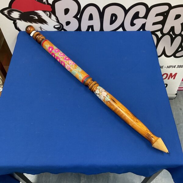 Large hand-painted wooden pencil with colourful floral design.