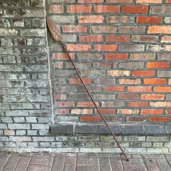 Antique Zulu spear with iron head and wooden shaft.