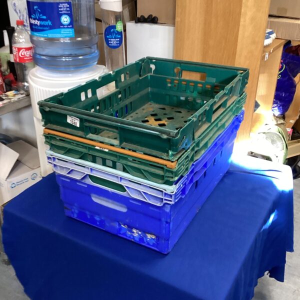 Lot of three plastic stacking storage crates for organization.