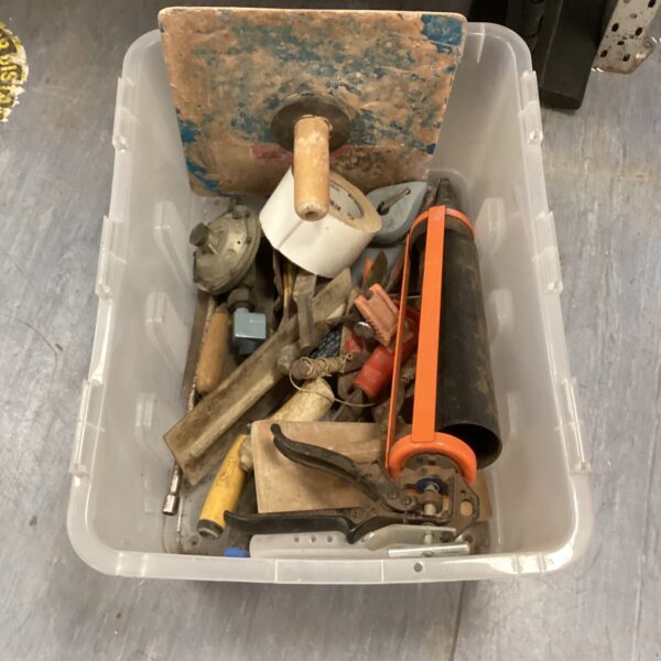 Vintage builder’s tool lot with plasterer’s mug board.