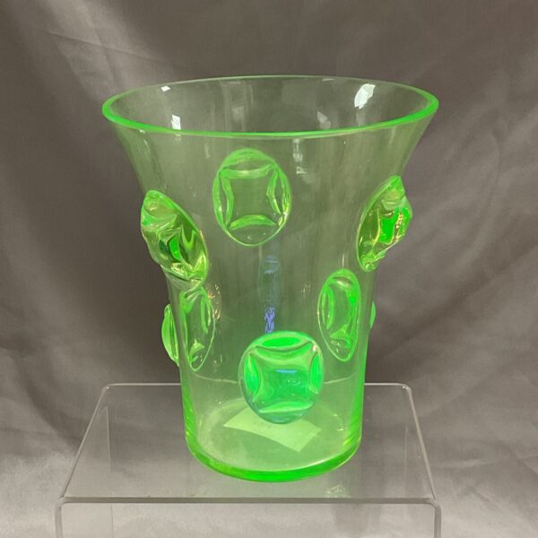 Vintage green uranium glass vase with raised details.