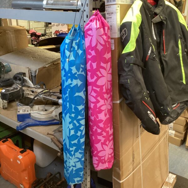 Blue and pink folding camping chairs for outdoor use.