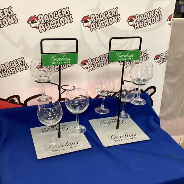Vintage Gordons Gin glass stands for display and collection.