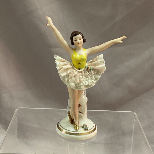 Vintage Dresden porcelain ballerina figure with white tutu.