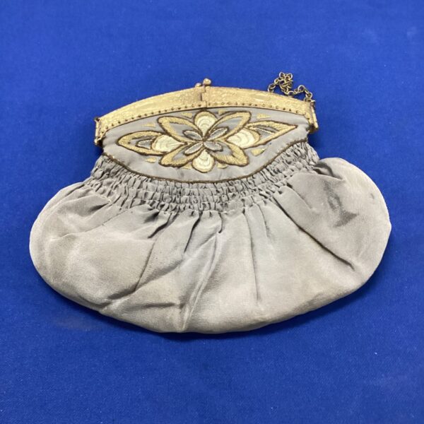 Delicate Victorian silk purse with floral embroidery.