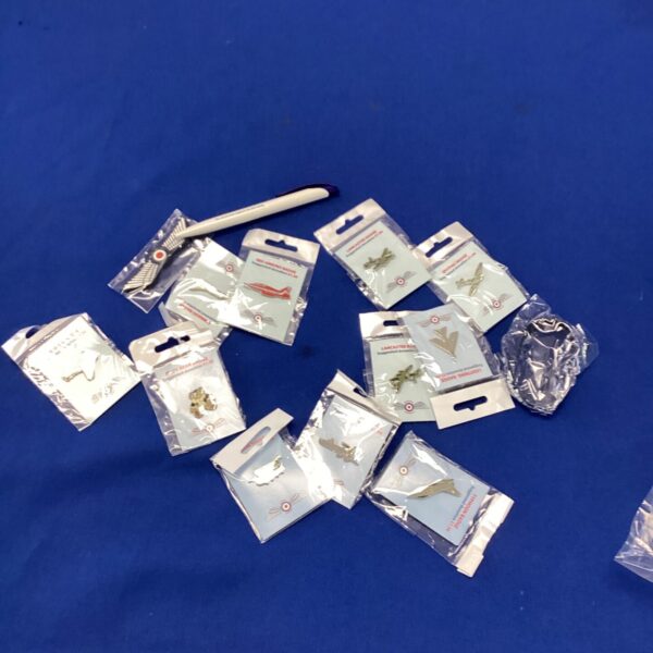 Selection of RAF badges in protective sleeves.