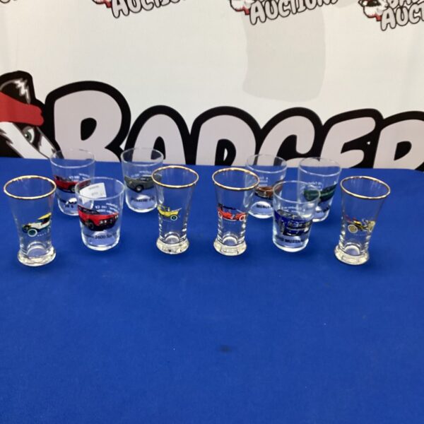 Lot of car decorated collectible glasses for enthusiasts.
