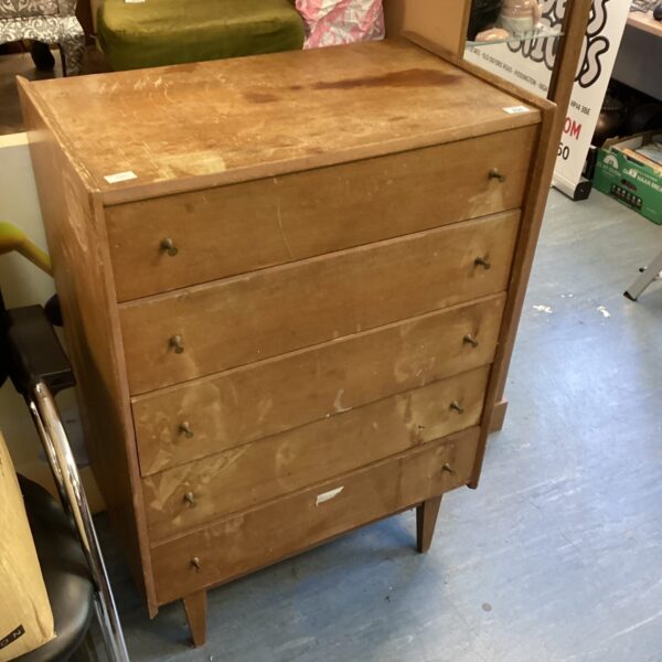 Antique mahogany chest of drawers with inlaid detailing.