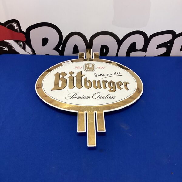 Vintage Bitburger beer sign, classic German brewery advertising.