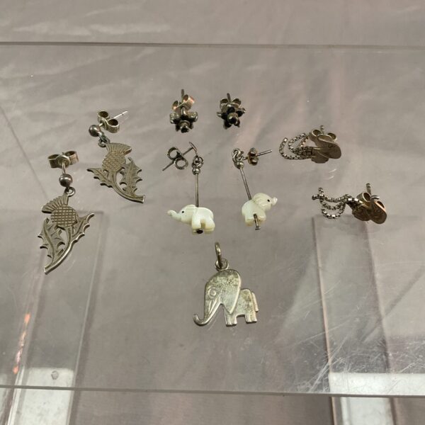 Silver stud earrings and elephant pendant jewellery lot.