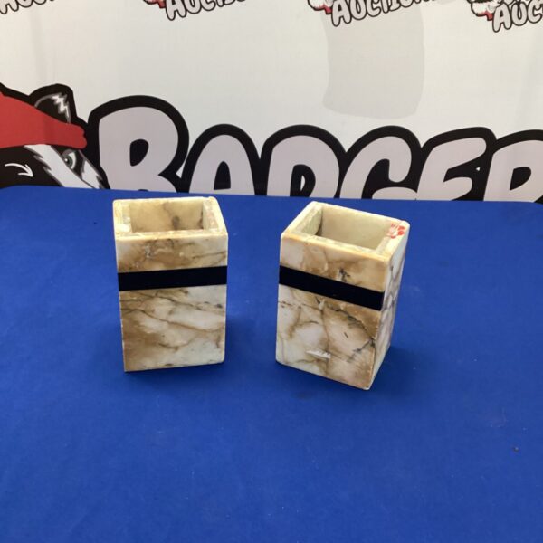 Pair of vintage marble flower holders for floral displays.
