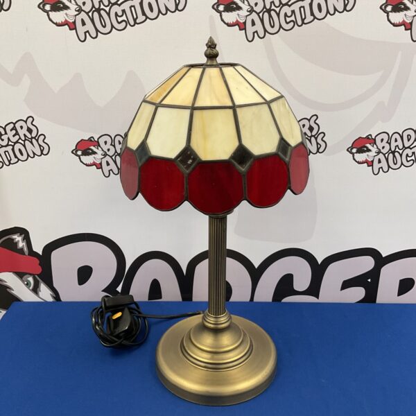 Vintage Tiffany style table lamp with red glass shade.