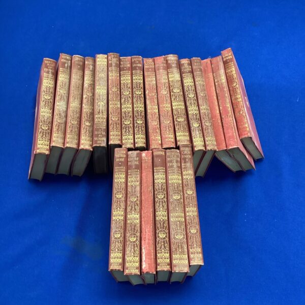 Collection of antique Stanley Weyman novels with leather bindings.