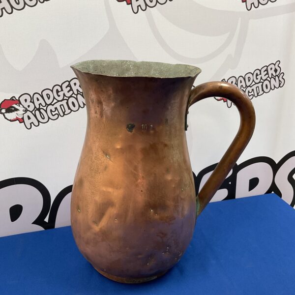 Large vintage copper jug with patina, ideal for kitchen display.