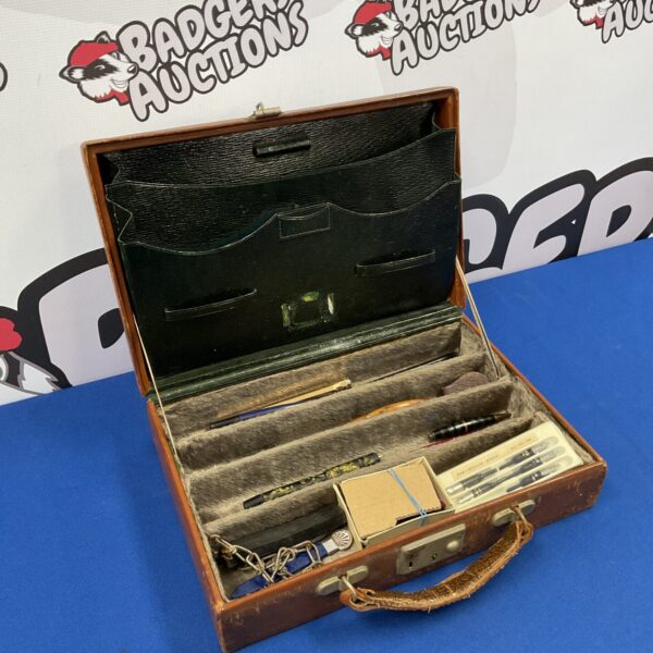 Vintage leather stationery case with vintage writing set inside.