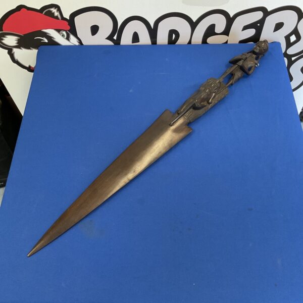 Hand-carved African spearhead, detailed hardwood carving.