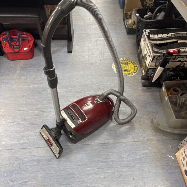 Miele C3 cylinder vacuum cleaner in a domestic setting.