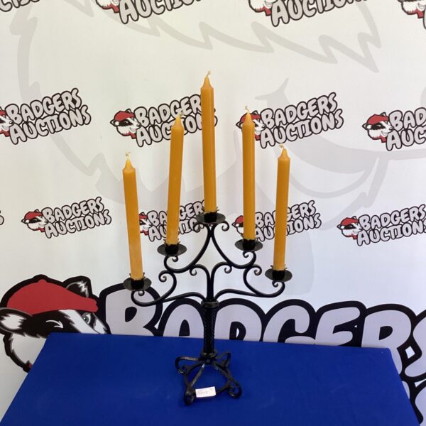 Ornate antique metal candelabra with multiple candle holders.