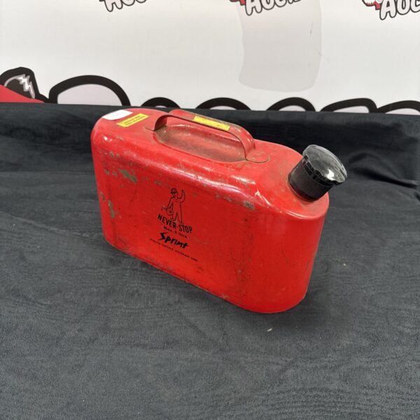 Red vintage Never-Stop 5 litre Jerry Can for fuel storage.