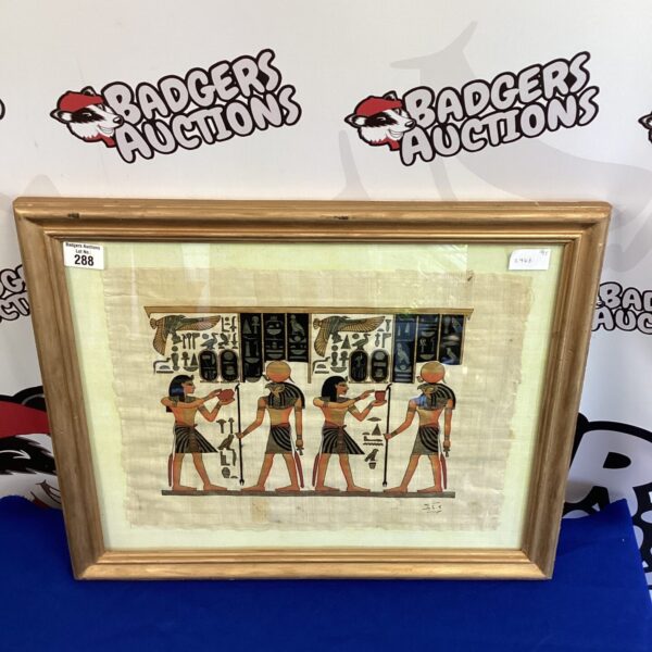 Framed Egyptian wall art depicting ancient Egyptian figures and hieroglyphics.