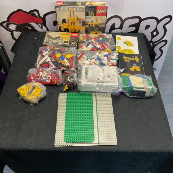 Vintage Lego collection with sets, parts, and figures.