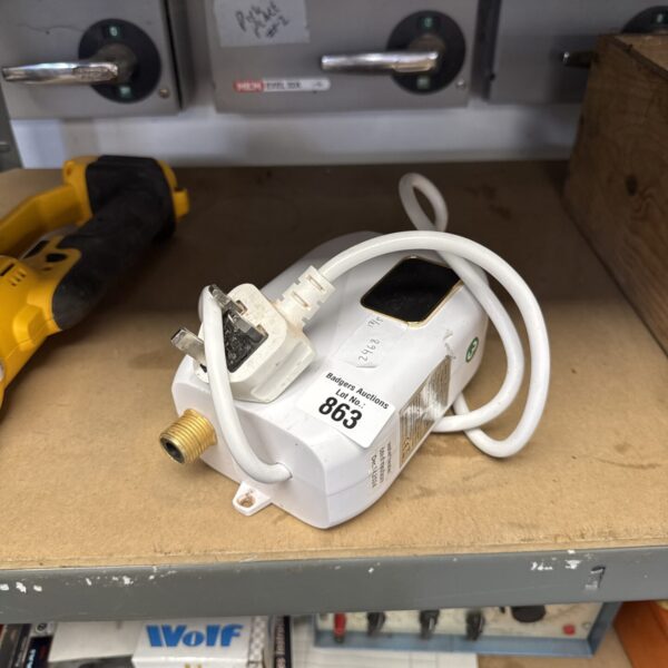 White E.T.N small water heater with auction sticker.