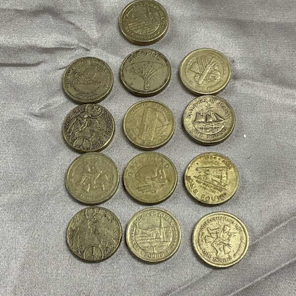 Lot of thirteen commemorative pound coins for collectors.