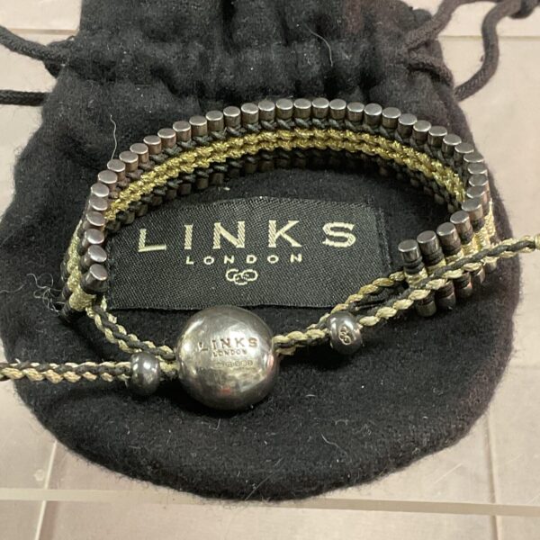 Silver Links of London bracelet with dark beads.