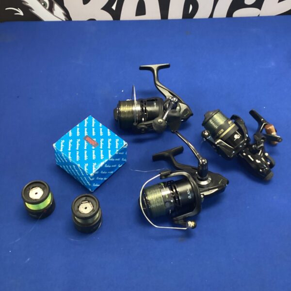 Fishing reel lot including Okuma, Korum Zelos, and vintage models.