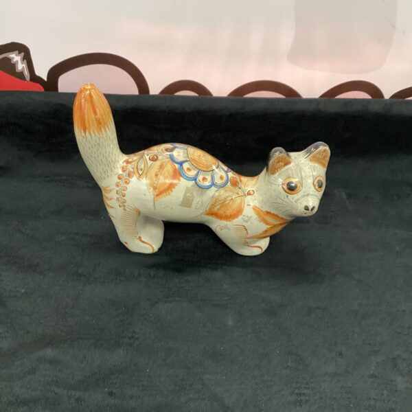 Vibrant Tonala pottery cat with colourful hand-painted designs.