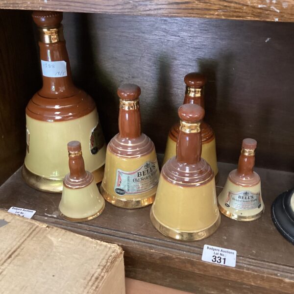 Vintage Bells Scotch Whisky pottery bottles in a lot.