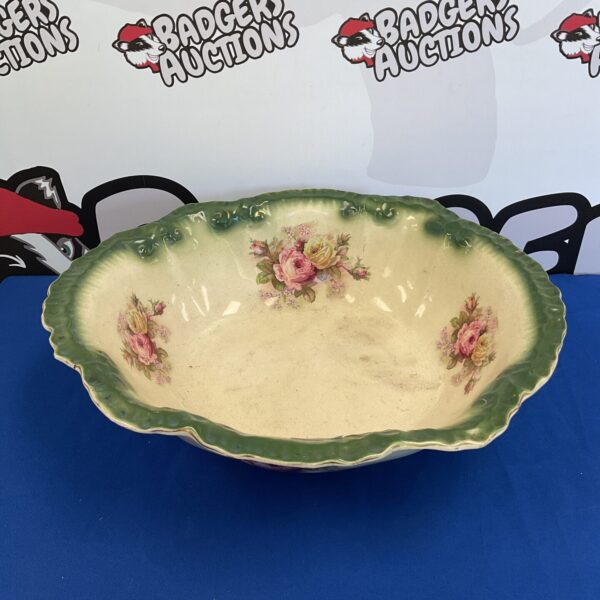 Antique Victorian porcelain wash bowl with a delicate rose design.