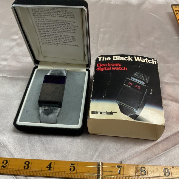 Vintage Sinclair Black Watch in original box, front view.