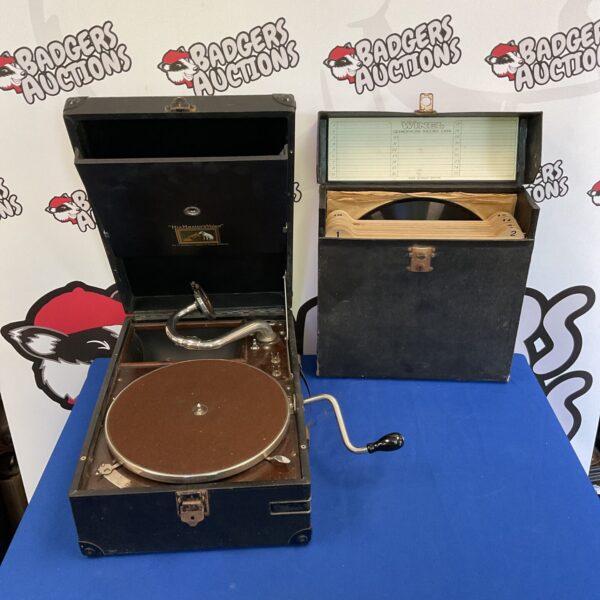 Vintage HMV gramophone with a case of records for collectors.