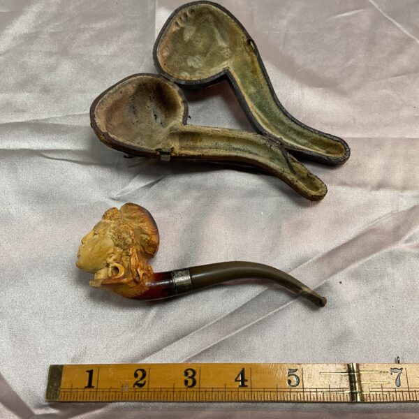 Antique meerschaum pipe with lady head carving and protective case.