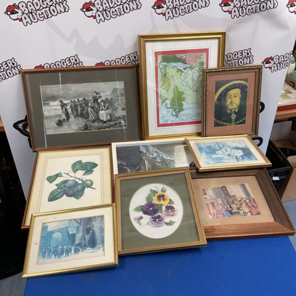 Assorted vintage framed prints displayed together.