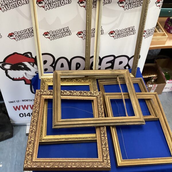 Vintage gold picture frames lot for display or collection.