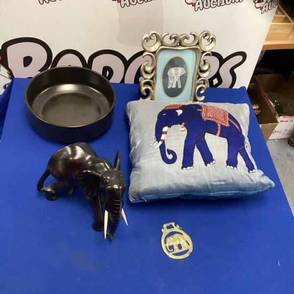 Vintage resin elephant figurine with Poole Pottery.