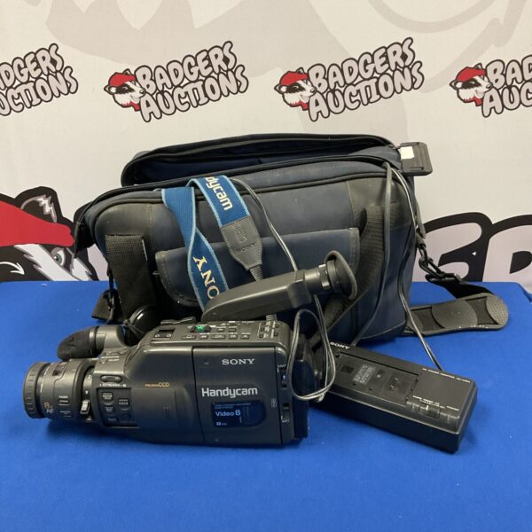 Vintage Sony Handycam CCD-F450E camcorder with strap.