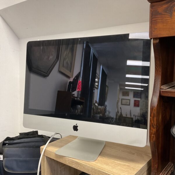 Apple iMac A1311 computer, a vintage all-in-one desktop.