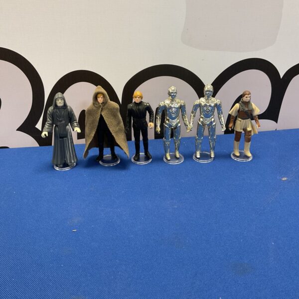 Vintage Star Wars figures lot including Darth Sidious and Luke Skywalker.