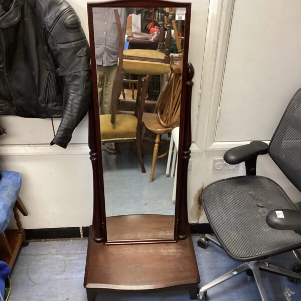 Vintage darkwood bedroom mirror with full length reflection.
