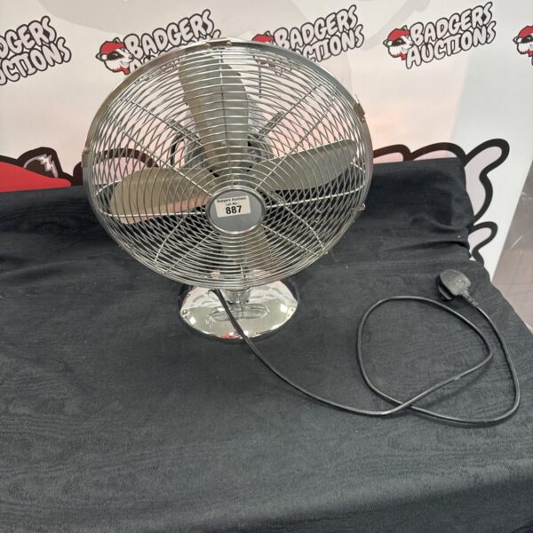 Vintage chrome desk fan with oscillating function.