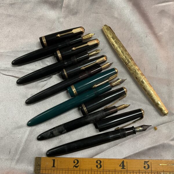 Lot of seven vintage Parker fountain pens with gold nibs.