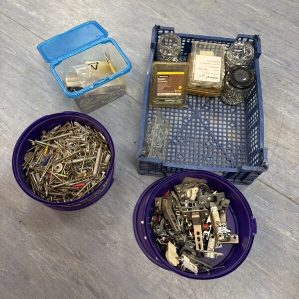 Assorted screws and nails in a shed clearance lot.