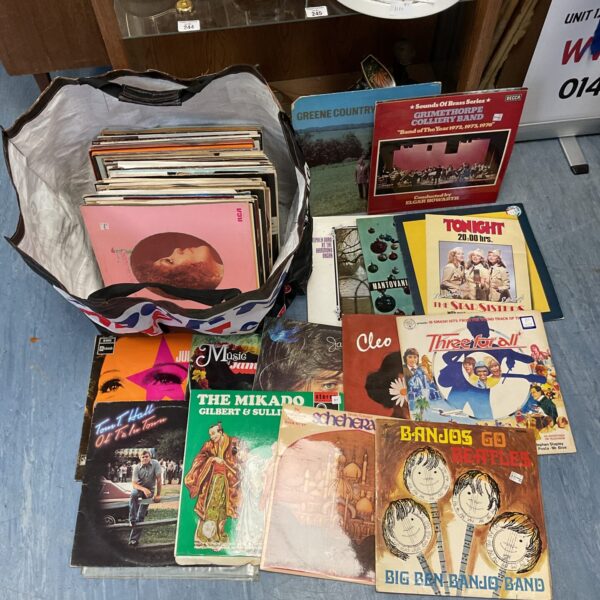 Vintage vinyl record collection lot with diverse album covers.