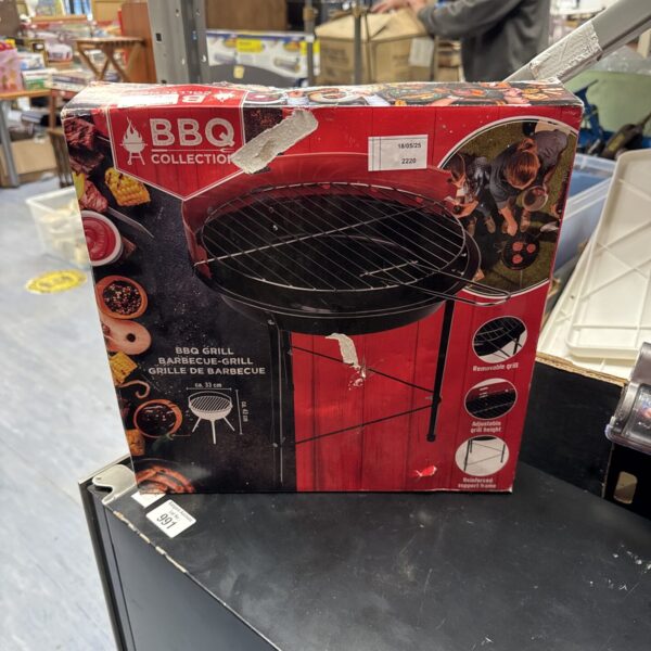 New BBQ grill 33cm in original packaging, ready for outdoor cooking.