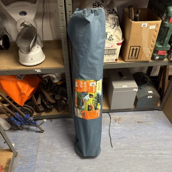 Rolled Adventuridge camping bed, ready for outdoor adventures.