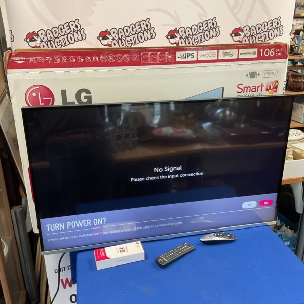 LG 42 inch smart TV with remote control for sale.