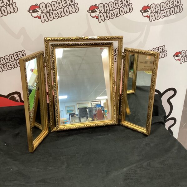 Ornate gilt framed triple mirror for bedroom or vanity.